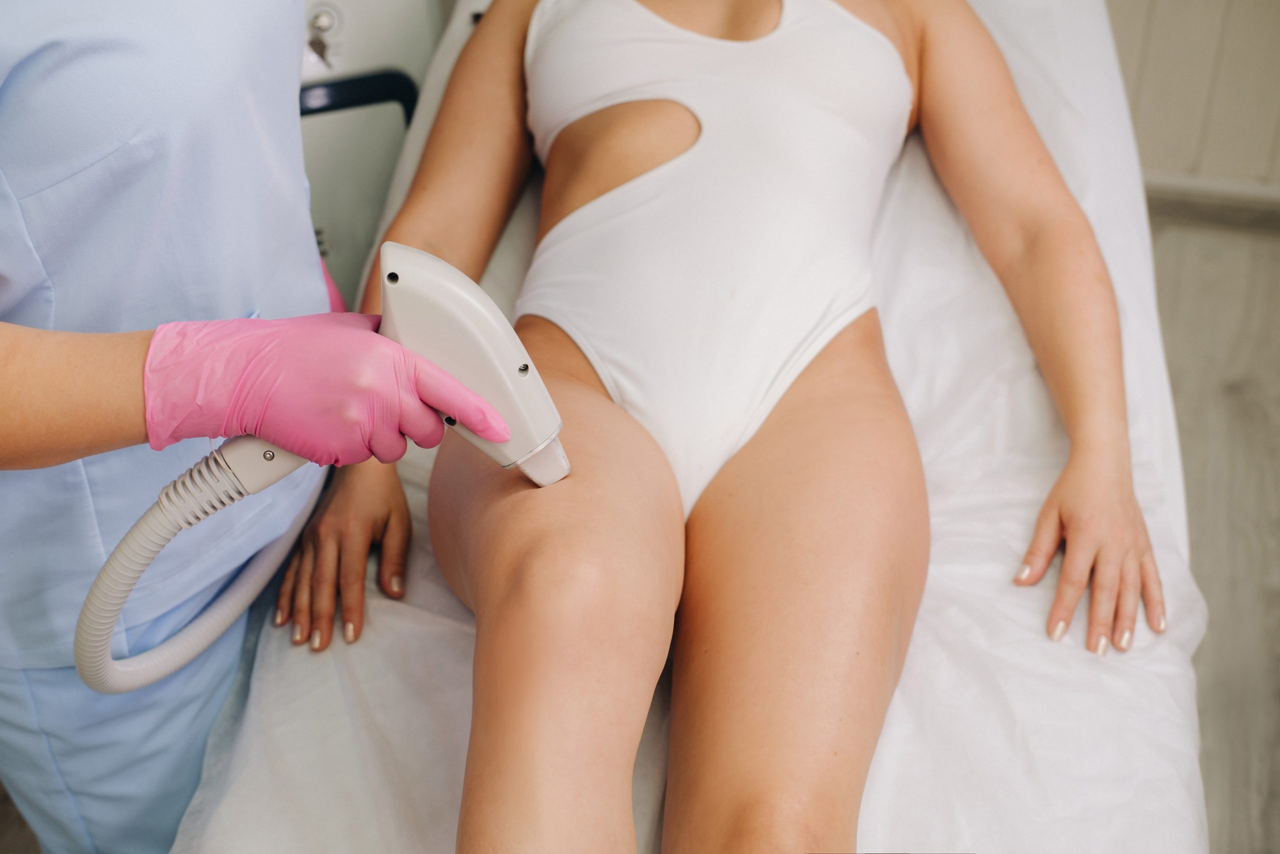 A close-up of the work of a cosmetologist who performs a laser hair removal procedure in the office